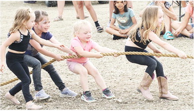 Youngsters Battle During Tug Of War Competition In Poplar