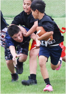 Little Wolves Compete  In Flag Football Action