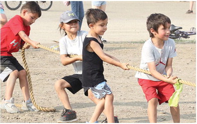 Youngsters Battle In Tug Of War During Wild West Days