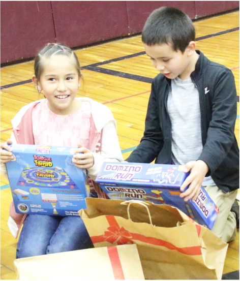 Professionals Deliver Gifts To Students