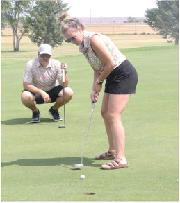 Couples Compete In Local Golf Tournament Couples Compete In Local Golf Tournament