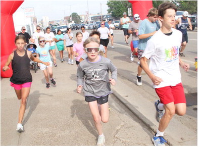 Runners Earn Honors In Human Stampede Runners Earn Honors In Human Stampede