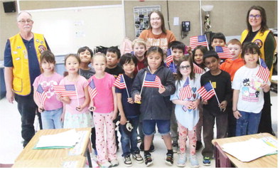 Lions Club Presents Flags To Local First-grade Students
