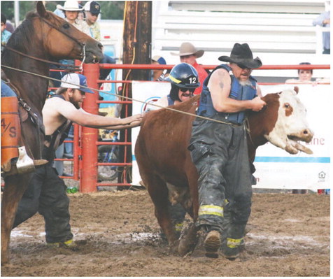 Fire Department Benefits From Milking Contest Fire Department Benefits From Milking Contest